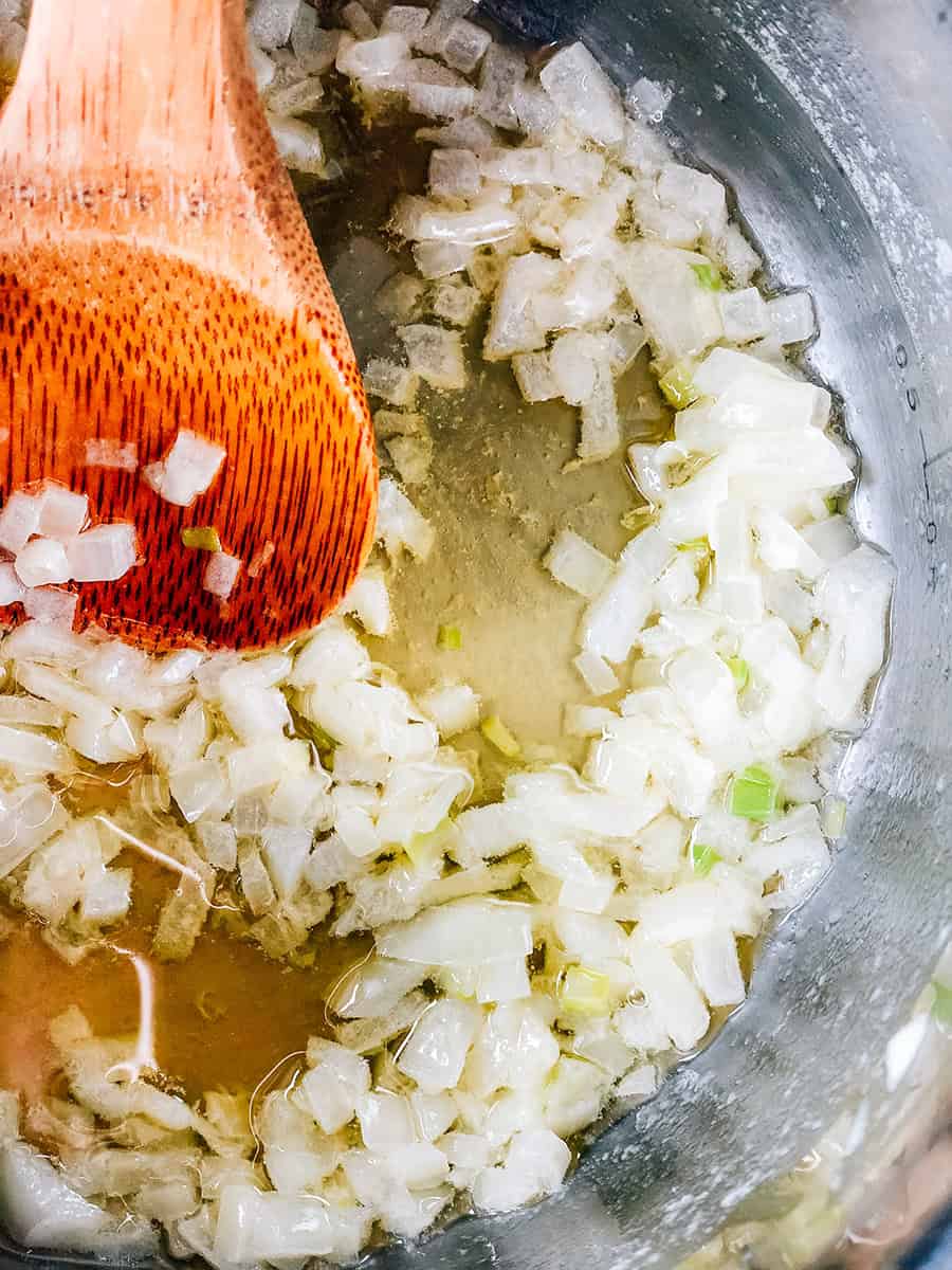 Onions wilted in butter first step in making the sauce for this classic chicken pot pie.