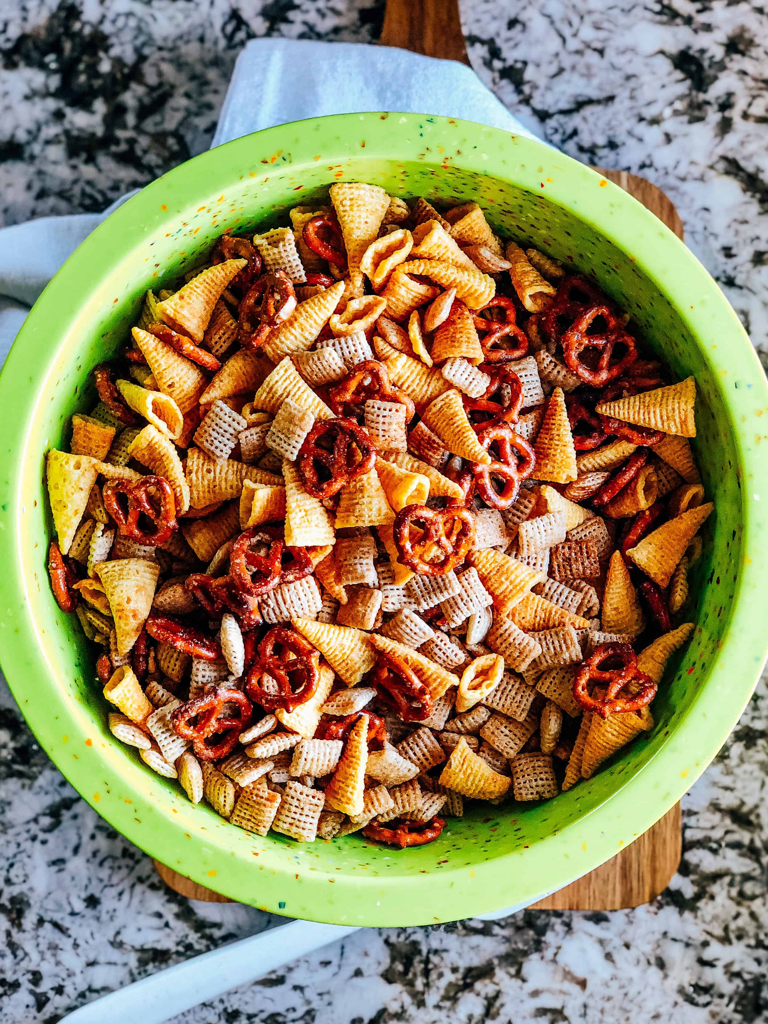 The completely baked and cooled snack mix in a large bowl.