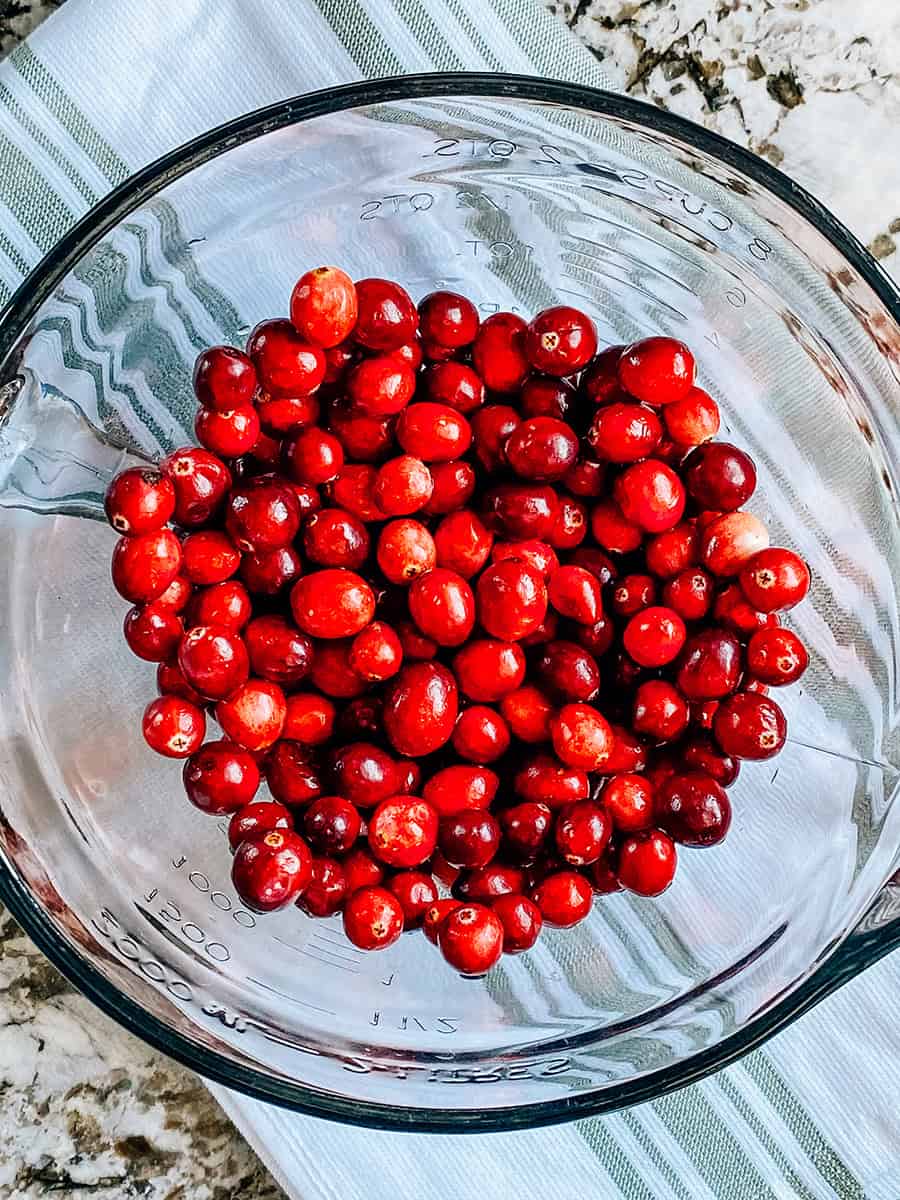 Cleaned fresh cranberries in a medium bowl.