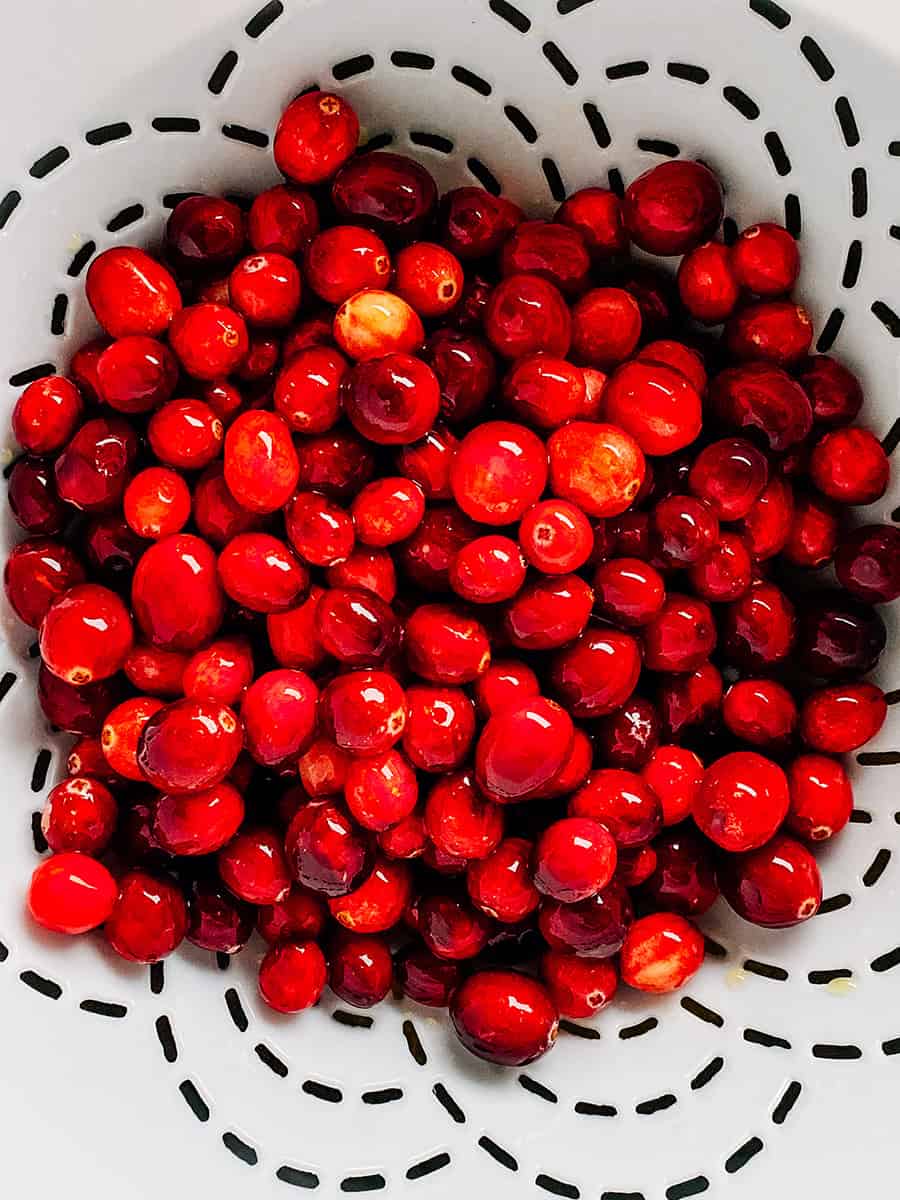 Drained fresh cranberries in a colander.